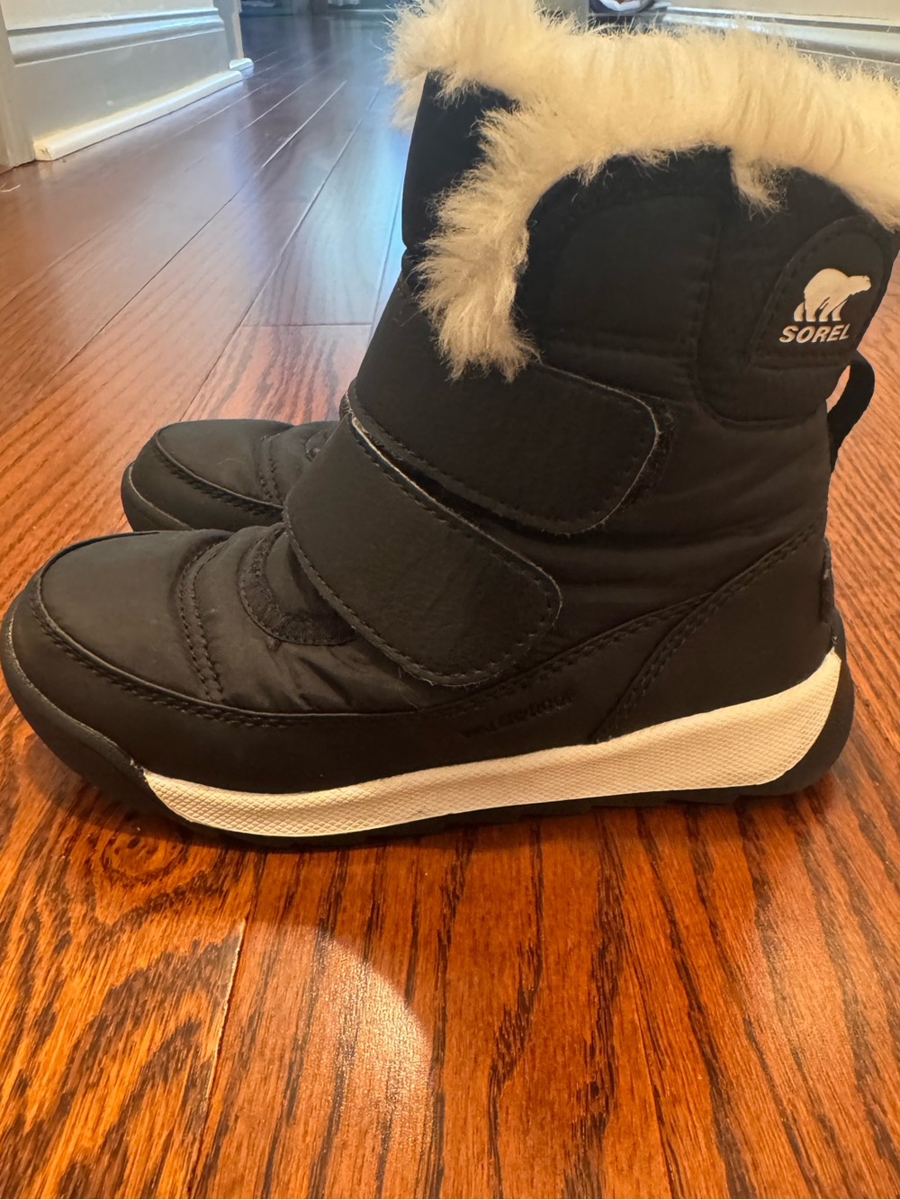 Sorel Kids Black Snow Boots with Cream Faux Fur Trim
